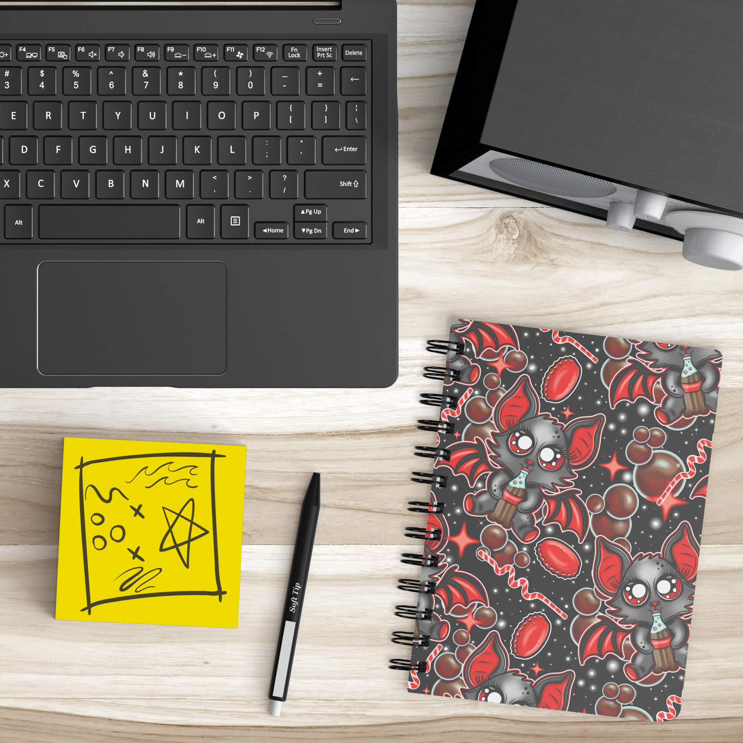 Cola_Bat_Notebook_SB_Lifestyle_Mockup.png